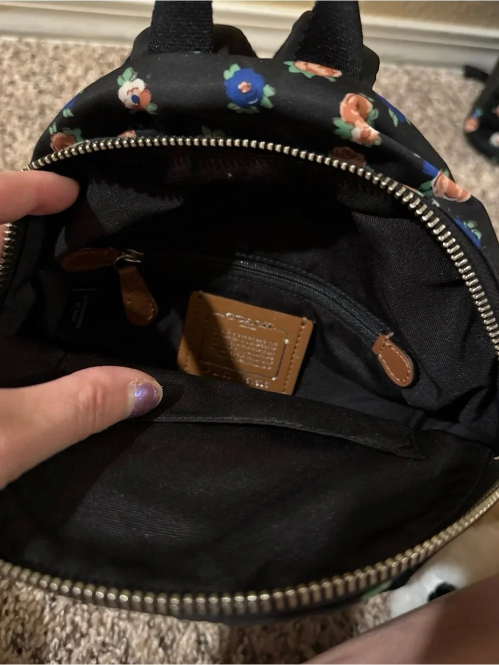 Coach Black Floral Mini Backpack with Wolf Patch Accent